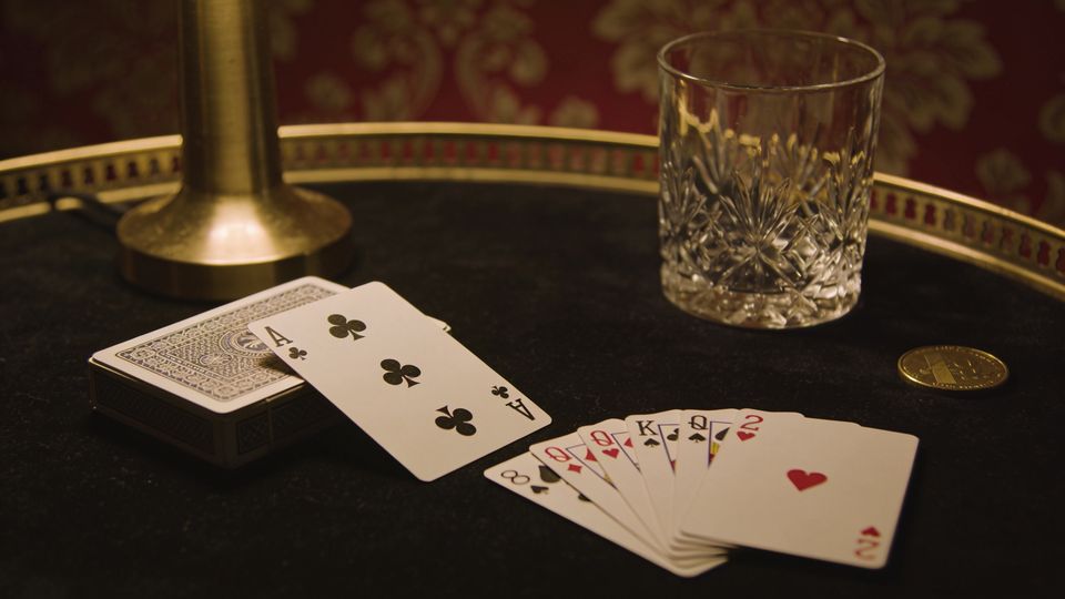 Whist on the W.F.A. deck, on black velvet under a brass lamp