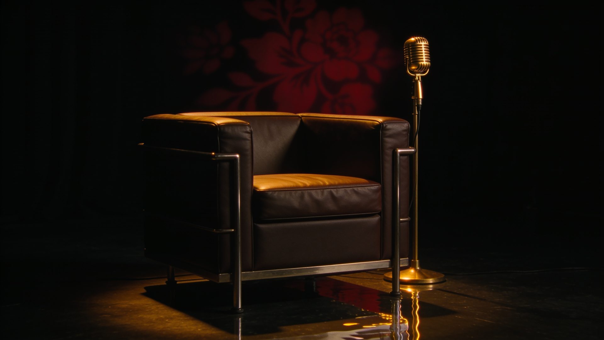 An empty interview chair in a pool of warm light